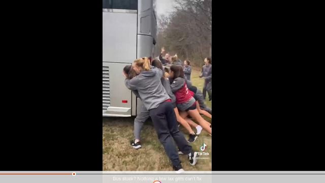 Teamwork: Elon Women's Lacrosse Team pushes together to free bus stuck in mud 
