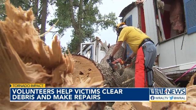 Volunteers help victims clear debris and make repairs from tornado damage