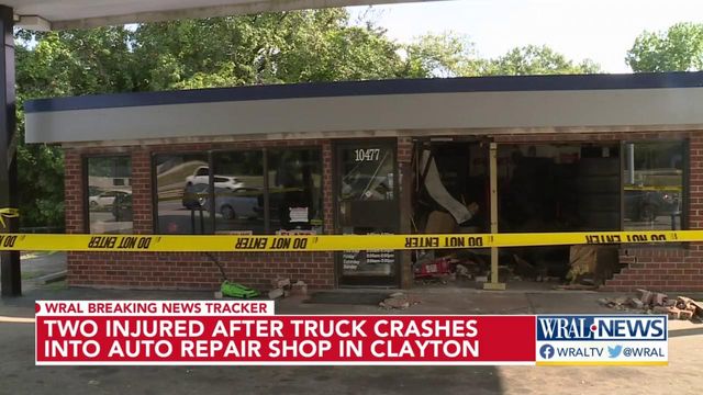 Two people injured after truck crashes into auto repair shop in Clayton