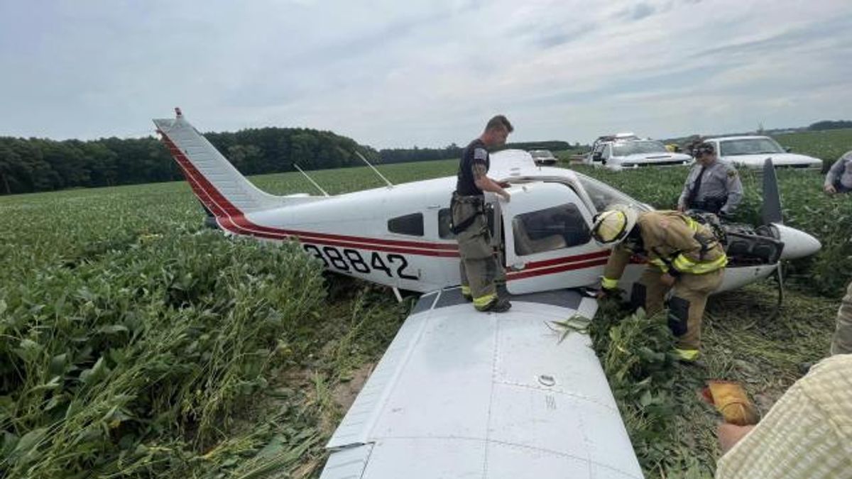 Two people were hospitalized after making an emergency landing Thursday morning in a soybean field.