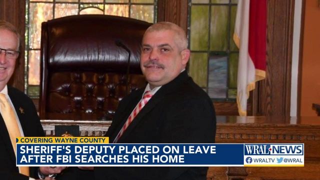 Sheriff's deputy placed on leave after FBI searches his home