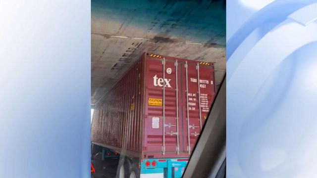 Dash cam: Truck trapped beneath Durham railroad bridge