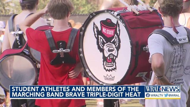Student athletes and members of the marching band brave triple digit heat