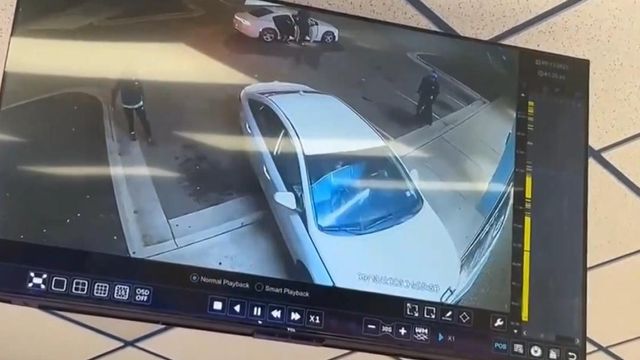 Surveillance video shows car crashing into Raleigh tobacco store 