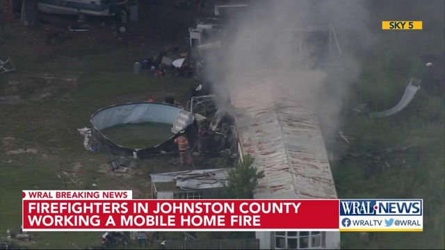 Johnston County firefighters working to put out fire at mobile home park