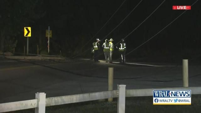 Large power lines blocking Lake Wheeler Road after apparent crash breaks power pole