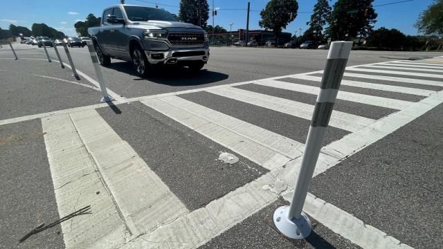 New barriers at Capital Boulevard and Calgary Drive in Raleigh shorten the crosswalk distance for pedestrians and force drivers to slow down to turn.