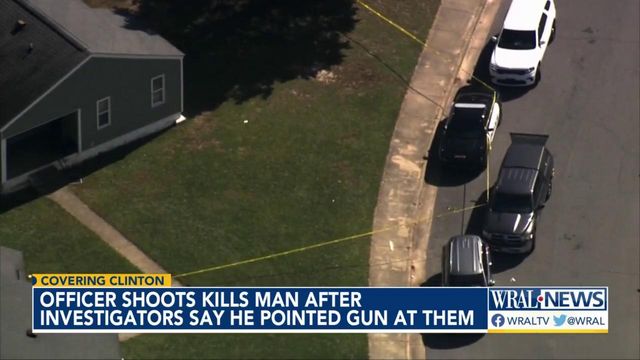 Officer shoots, kills man after investigators say he pointed gun at them