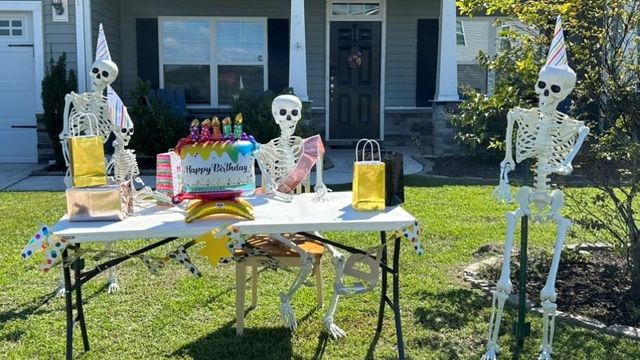 The Blakefield Bo<em></em>nes change position and outfits to keep neighbors delighted through the Halloween season.