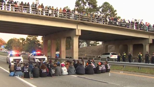 4th protester surrenders after charge in illegal protest that shut down Durham Freeway
