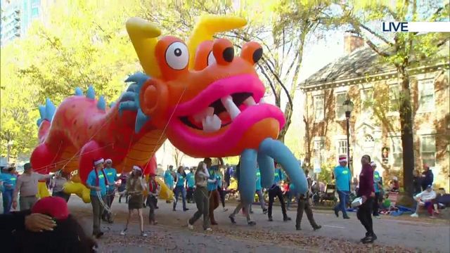 Life-sized dragon floats through Raleigh Christmas Parade 