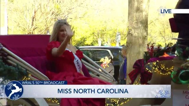 Miss North Carolina graces the Raleigh Christmas Parade on a fancy horse carriage