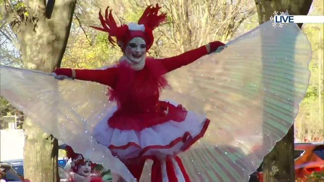 Bedazzled stilt-walkers, hula-hoopers bring Imagine Circus to Raleigh Christmas Parade