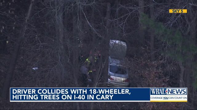 Driver collides with 18-wheeler in Cary, hitting trees on I-40