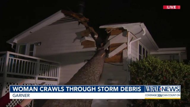 Woman crawls through storm debris during Tuesday's storms