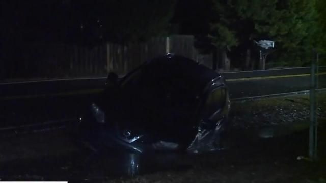 Road closed Car stuck in flooded ditch alongside Barbee Road in