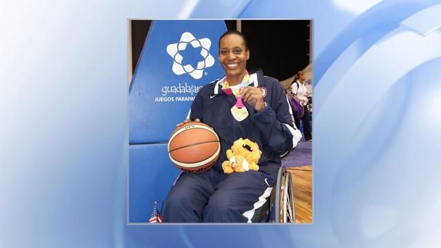 Andrea Woodson-Smith celebrates her success in wheelchair basketball.
