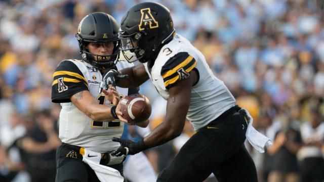 Quarterback Zac Thomas (12) of the Appalachian State Mountaineers. App State travels to Chapel Hill, N.C. to face off against the Tar Heels for a rare, in-state match-up. The App State Mountaineers outlasted the Tar Heels, winning the game with a final score of 34 - 31. (Photo By: Baird Photography / WRALSportsFan)