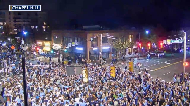 UNC fans rush Franklin Street in Chapel Hill after beating Duke 84-79