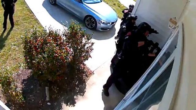 On April 7, 2021, Raleigh police executed a warrant at the home of Amir Abboud. Officers announced their entry and almost immediately rammed down the door of the home. Surveillance footage played in court on Tuesday, March 26, 2024. On April 7, 2021, Raleigh police executed a warrant at the home of Amir Abboud. Officers announced their entry and almost immediately rammed down the door of the home. Surveillance footage played in court on Tuesday, March 26, 2024.