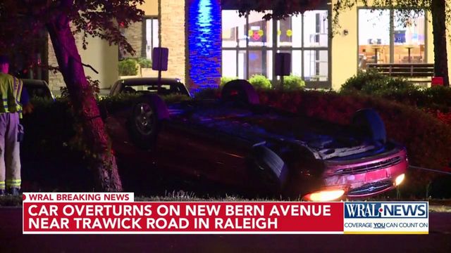 Car overturned after crashing into powerlines in Raleigh