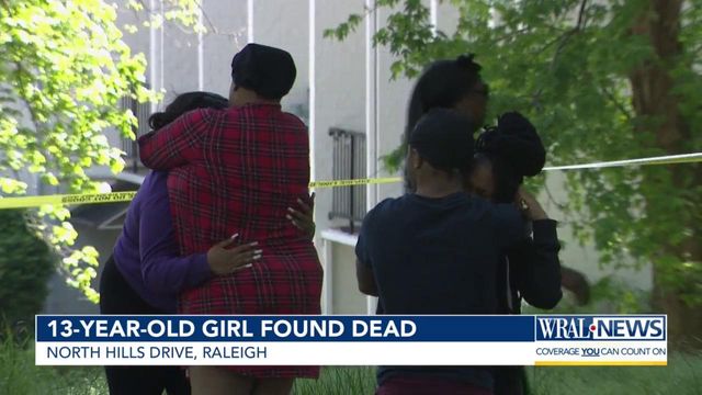 Mourners gather around Raleigh apartment where 8th grader was killed