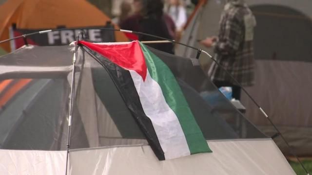 A Palestine flag sits across a tent on campus at UNC-Chapel Hill on Friday, April 26, 2024.