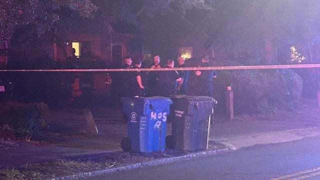 The officers are gathered at a home on the 400 block of West Club Boulevard.