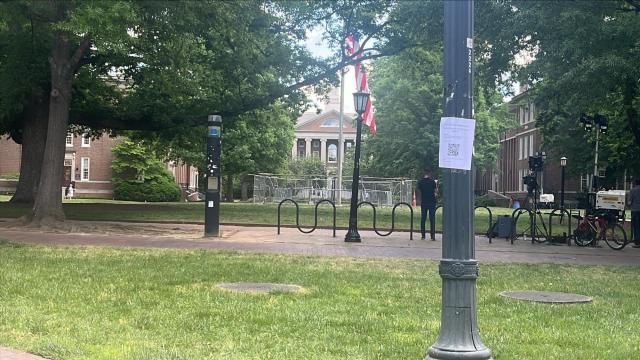 The main quad at UNC-Chapel Hill on Wednesday, May 1. A fence surrounds the flag pole after the U.S. flag was lowered on Tuesday during a pro-Palestine protest.