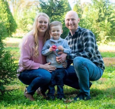 Officer Josh Eyer, wife Ashley Eyer and their young son.
