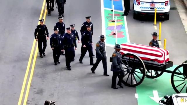 Hundreds of officers march in processional for fallen officer who died in Charlotte.