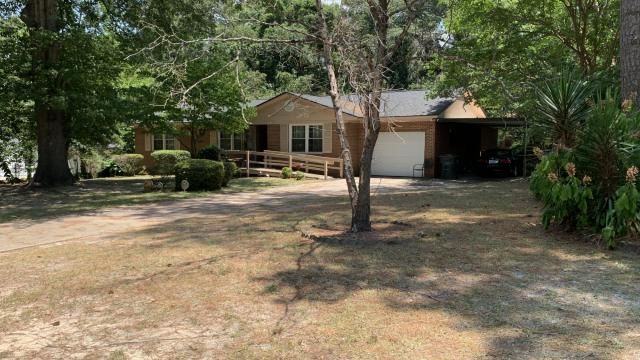Home of woman arrested in missing children case