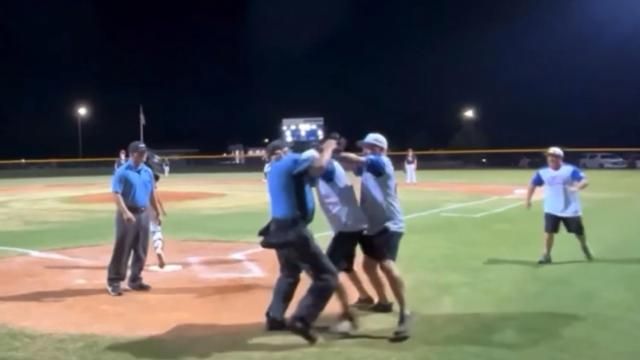 A coach pushed an umpire during a Little League game in Wilson Monday night and the umpire responded by hitting the coach several times with his mask.