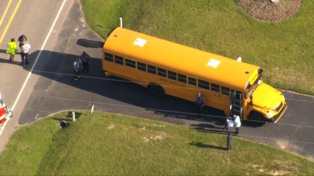 Emergency crews respond to Durham school bus accident involving motorcyclist