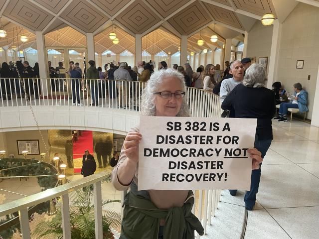 The North Carolina House's veto override followed an emotional debate on the chamber floor and as demonstrators packed the gallery and the halls of the legislative building, wielding signs and singing protest songs. At least one protester was arrested.