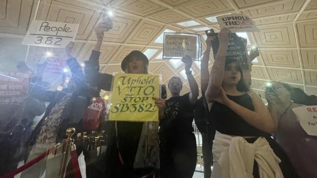 The North Carolina House's veto override followed an emotional debate on the chamber floor and as demonstrators packed the gallery and the halls of the legislative building, wielding signs and singing protest songs. At least one protester was arrested.