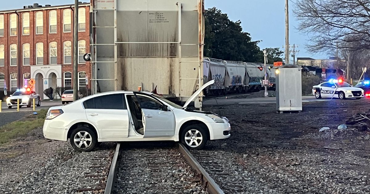 Freight train and car collide in downtown Durham, man injured :: WRAL.com