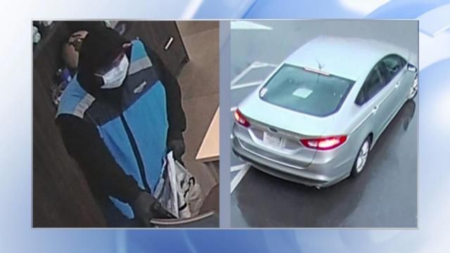 Raleigh police are asking for the public's help in identifying a person suspected of an armed robbery on May 14 at a Fifth Third Bank along East Six Forks Road. Police also released a picture of a silver, four-door sedan.