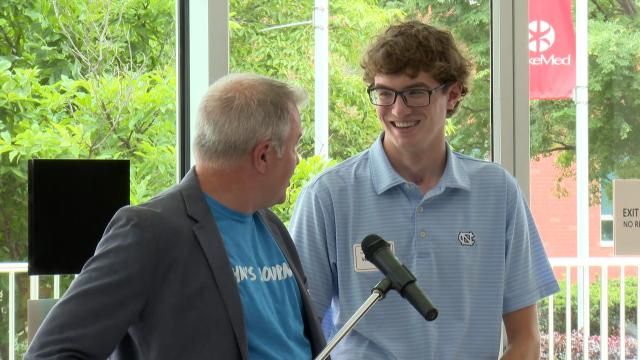 John Walter and father, Rob Walter, speak at an event celebrating trauma survivors at WakeMed on May 29, 2025.
