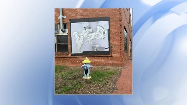 Vandalized photo mural in Wilson, North Carolina.
