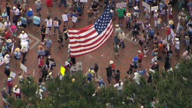 In downtown Durham, costumes, signs protest Trump policies
