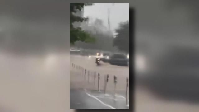 A truck drove through floodwaters on Monday night in Raleigh's Smoky Hollow development.