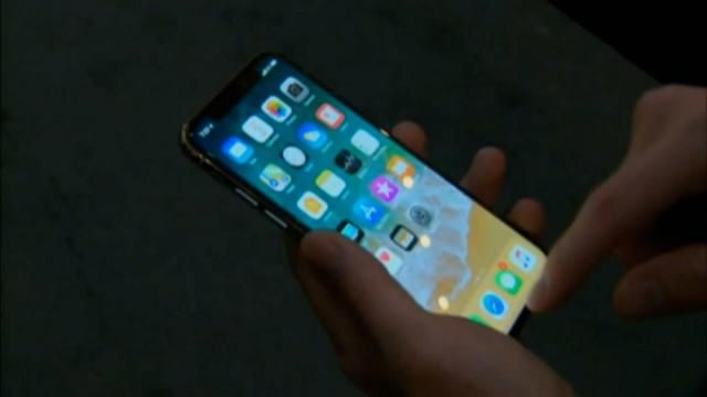 A file photo of someone holding an iPhone.