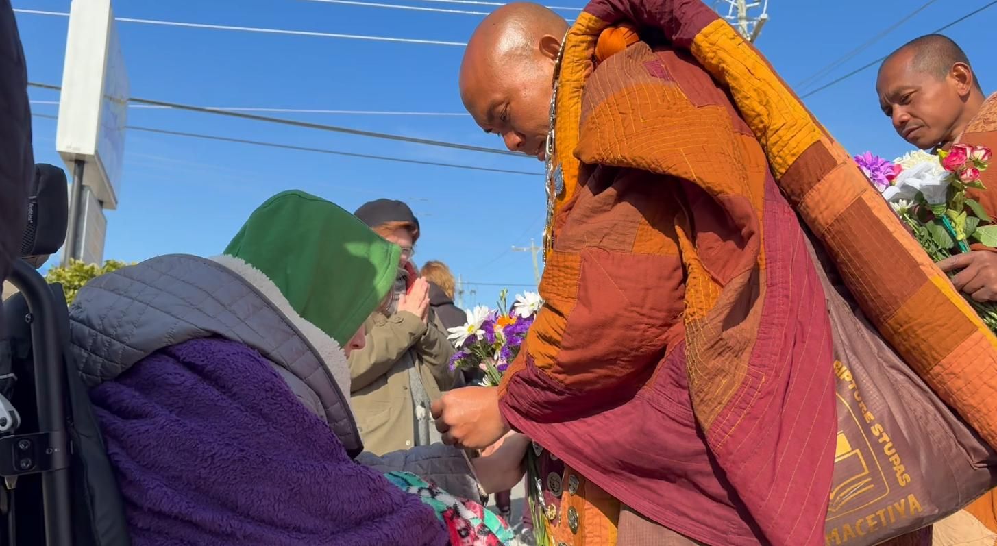 Monk Walk for Peace makes way along U . S . 64