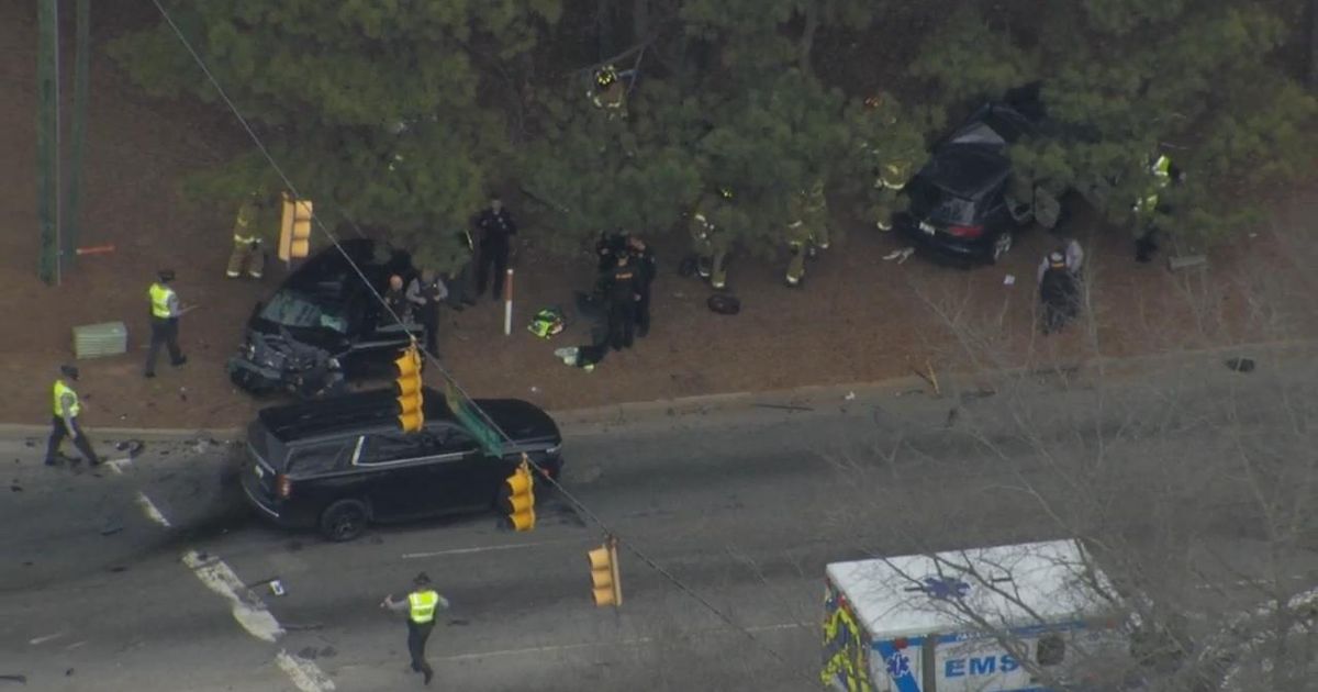 Major Raleigh crash blocks Tryon Road intersection, car in woods