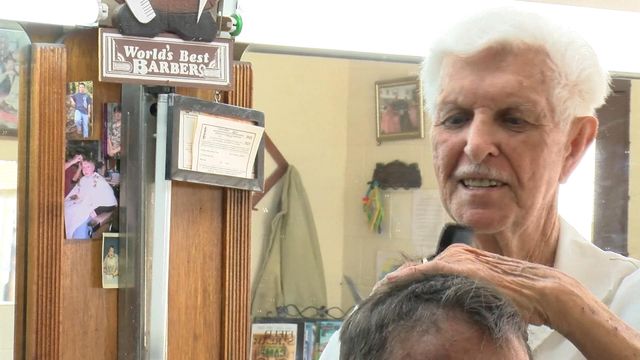 Twin barbers still in trim at age 85