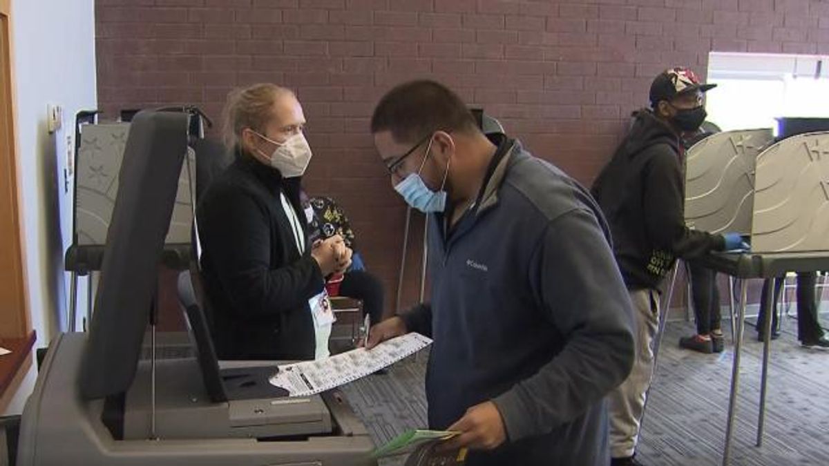 Voters cast their ballot at Durham South Regional Library polling site.