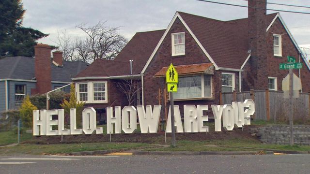 How are you? Artists install 'welcome fence' in front yard