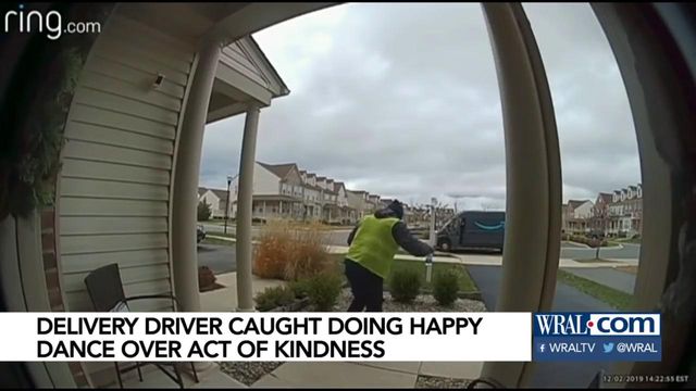 Amazon delivery driver does happy dance after getting Christmas treats