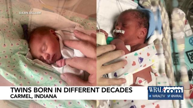Twins born minutes apart, technically in different decades, during New Year's Eve